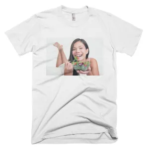 Smiling woman eating a healthy vegetable salad